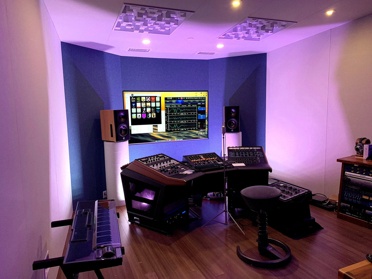 Mix room with violet LED uplighting, ceiling diffusers and a console desk