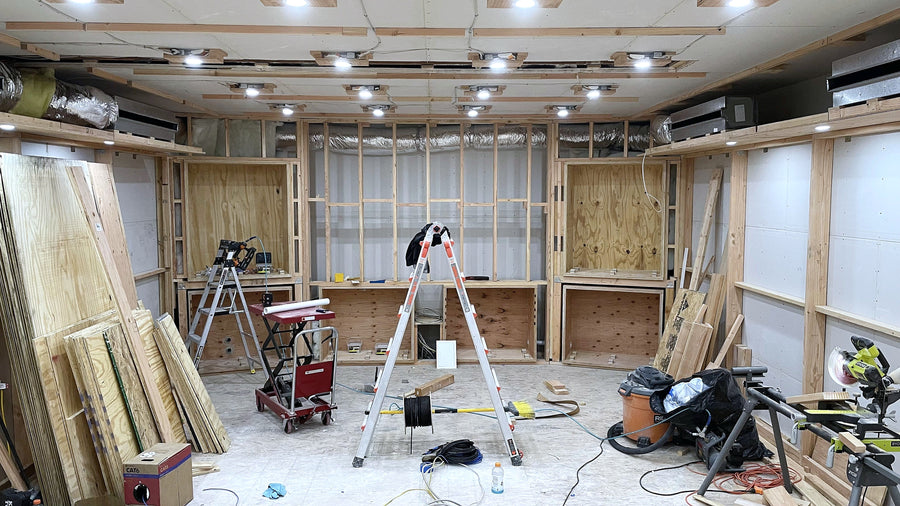 Calabasas control room during framing, with plywood and openings framed for the speakers in the front wall