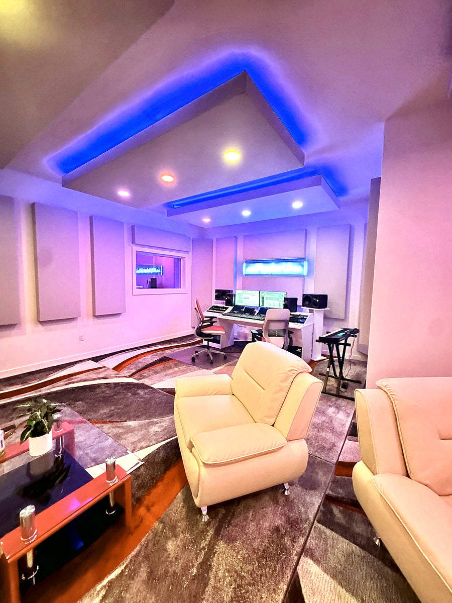 Studio lounge under LED lit ceiling clouds, looking into the control room of a Las Vegas recording studio