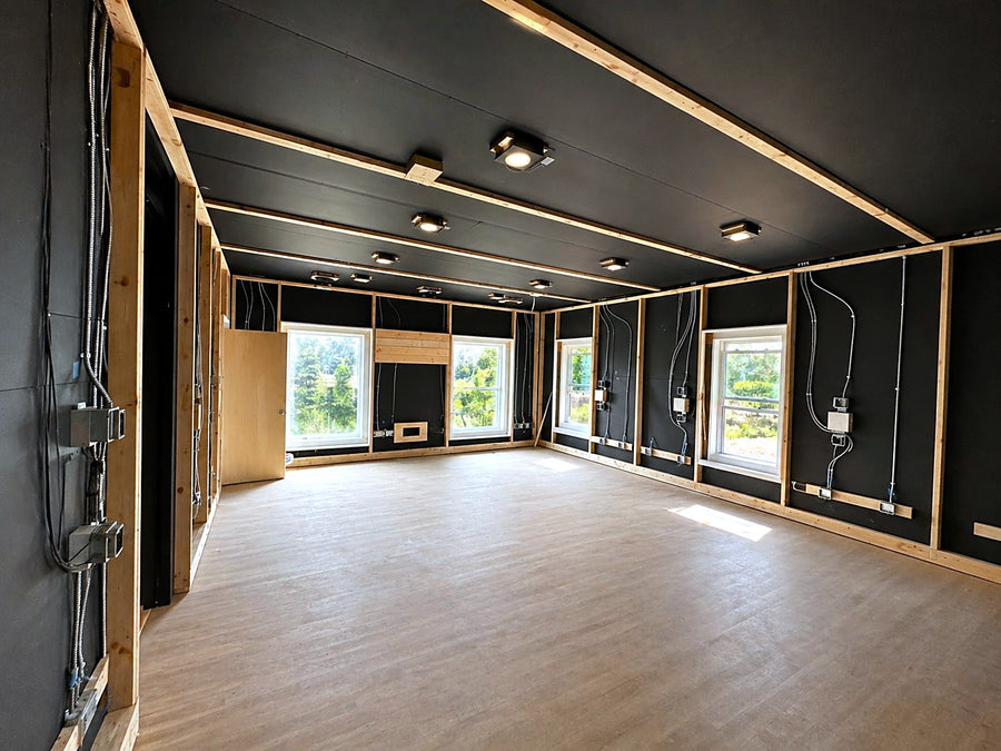 South Carolina Dolby Atmos music room mid-build, with black walls and wood battens before the fabric went up