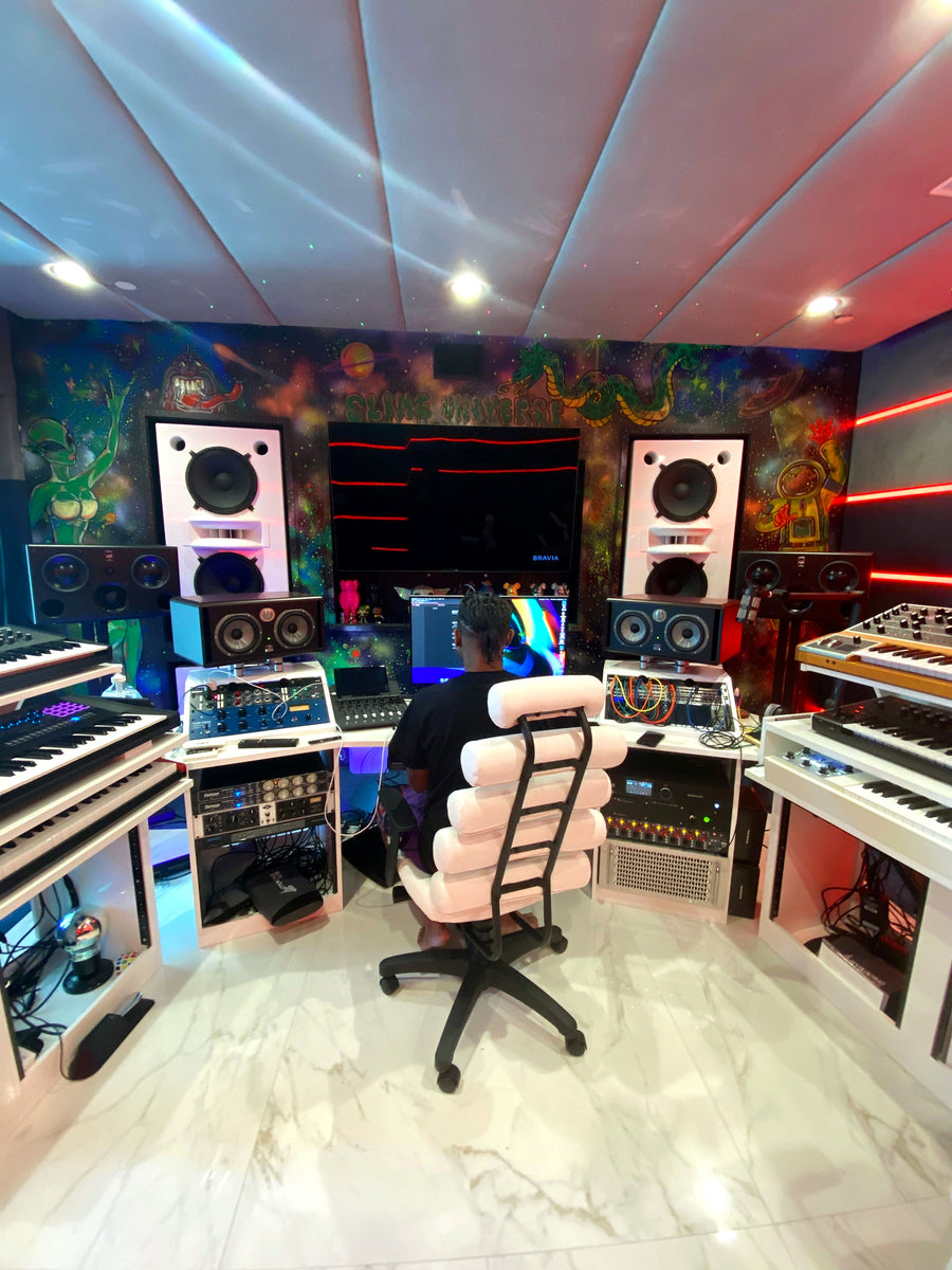 Production suite with fabric ceiling panels, a painted mural wall and white custom furniture